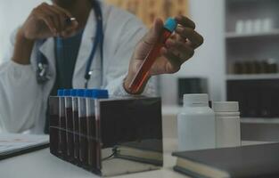 Professional lab. Amazing longhaired medical worker wearing uniform while using microscope during research photo