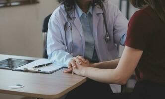 Cropped shot of a female nurse hold her senior patient's hand. Giving Support. Doctor helping old patient with Alzheimer's disease. Female carer holding hands of senior man photo