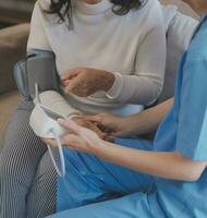 Doctor and patient talking while sitting at the desk in hospital office, closeup of human hands. Medicine and health care concept photo