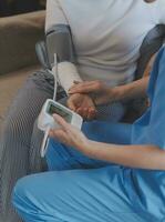 Doctor and patient talking while sitting at the desk in hospital office, closeup of human hands. Medicine and health care concept photo