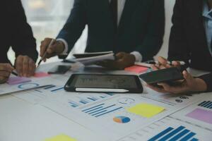 Entrepreneurs and business people conference in modern meeting room, happy multiracial coworkers have fun cooperating working together at office meeting, asian teamwork concept photo