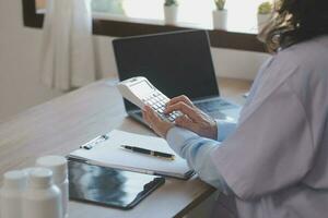 Medicine doctor touching tablet. Medical technology and futuristic concept. photo