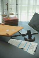 Business and lawyers discussing contract papers with brass scale on desk in office. Law, legal services, advice, justice and law concept picture with film grain effect photo