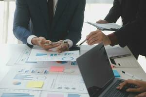 Entrepreneurs and business people conference in modern meeting room, happy multiracial coworkers have fun cooperating working together at office meeting, asian teamwork concept photo