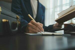 Business and lawyers discussing contract papers with brass scale on desk in office. Law, legal services, advice, justice and law concept picture with film grain effect photo