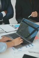 Entrepreneurs and business people conference in modern meeting room, happy multiracial coworkers have fun cooperating working together at office meeting, asian teamwork concept photo