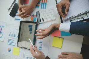 Entrepreneurs and business people conference in modern meeting room, happy multiracial coworkers have fun cooperating working together at office meeting, asian teamwork concept photo