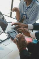 Entrepreneurs and business people conference in modern meeting room, happy multiracial coworkers have fun cooperating working together at office meeting, asian teamwork concept photo