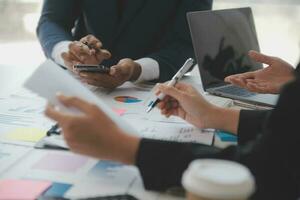 Entrepreneurs and business people conference in modern meeting room, happy multiracial coworkers have fun cooperating working together at office meeting, asian teamwork concept photo