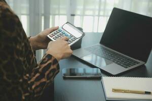 Audit concept,Administrator business man financial inspector and secretary making report calculating balance. Internal Revenue Service checking document. photo