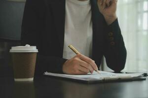 Audit concept,Administrator business man financial inspector and secretary making report calculating balance. Internal Revenue Service checking document. photo