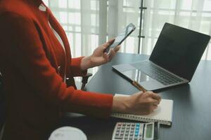 Audit concept,Administrator business man financial inspector and secretary making report calculating balance. Internal Revenue Service checking document. photo