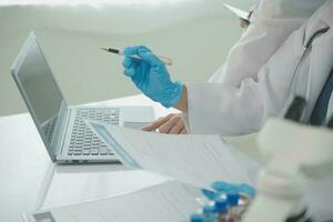 Health care researchers working in life science laboratory. Young female research scientist and senior male supervisor preparing and analyzing microscope slides in research lab. photo