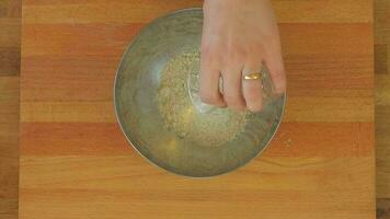 Adding Tahini to Flour With a Glass Scale video