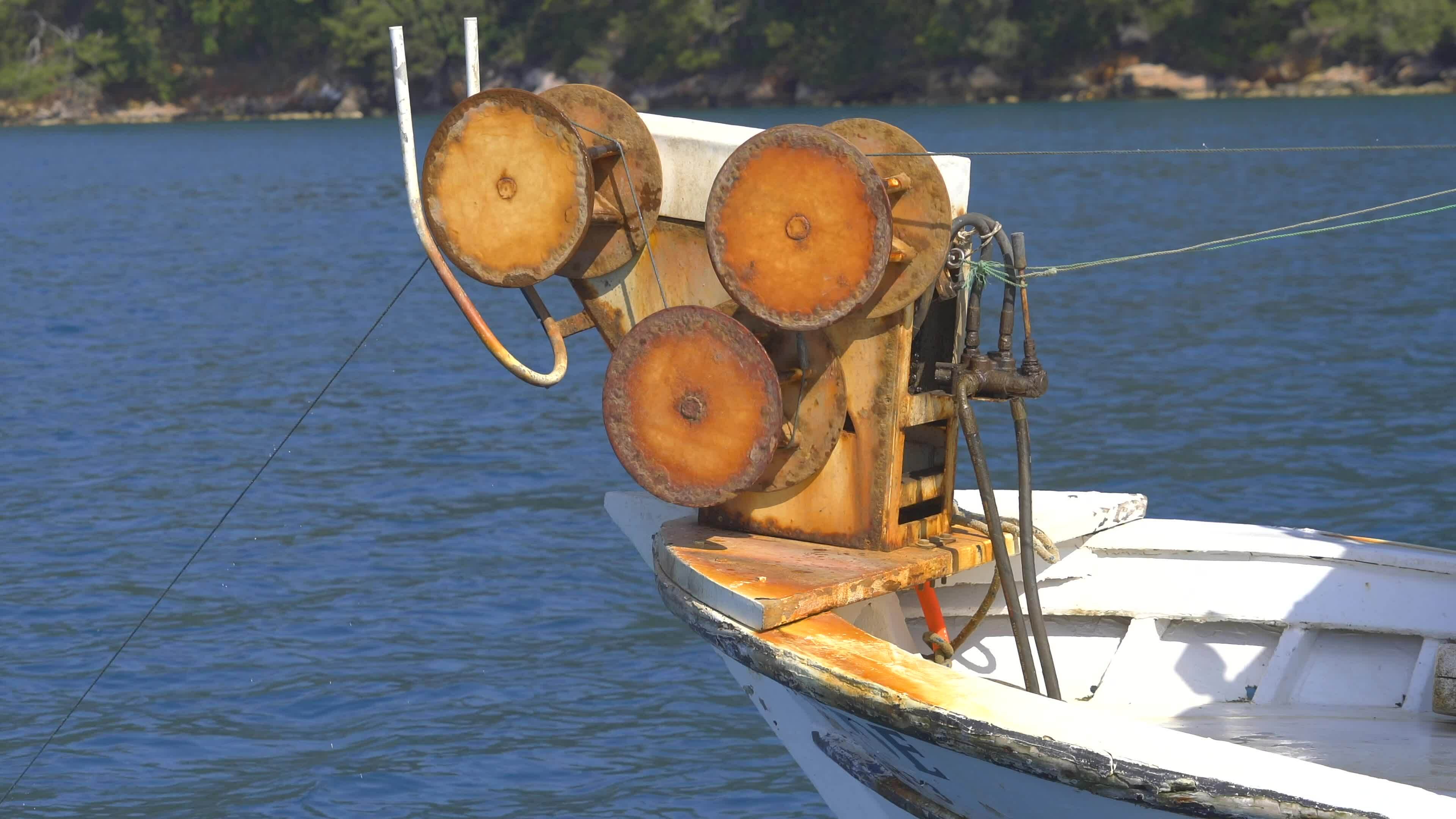 Net Reel on Small Fishing Boat Pulling Net 26572969 Stock Video at Vecteezy