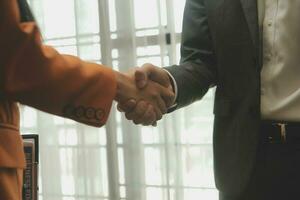 Business handshake for teamwork of business merger and acquisition,successful negotiate,hand shake,two businessman shake hand with partner to celebration partnership and business deal concept photo