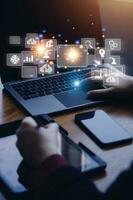 Big data analytics and business intelligence concept with chart and graph icons on a digital screen interface and a businessman in background photo