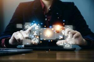 Big data analytics and business intelligence concept with chart and graph icons on a digital screen interface and a businessman in background photo