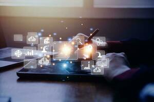 Big data analytics and business intelligence concept with chart and graph icons on a digital screen interface and a businessman in background photo