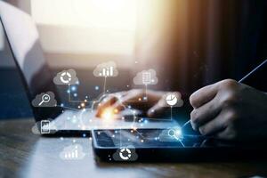man use Laptop with cloud computing diagram show on hand. Cloud technology. Data storage. Networking and internet service concept. photo