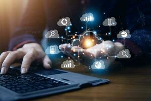man use Laptop with cloud computing diagram show on hand. Cloud technology. Data storage. Networking and internet service concept. photo