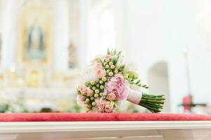 The bride's wedding bouquet is on the table photo