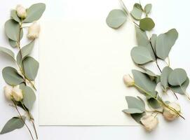 Empty card with eucalyptus leaves photo