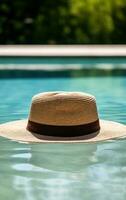 Summer hat near swimming pool photo