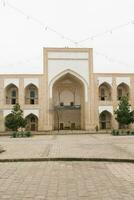 Bukhara, Uzbekistan. December 2022. The courtyard of the Kukeldash madrasah photo