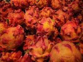 Large group of dragon fruit in the store photo