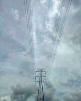 Electrical tower or transmission tower with cloudy photo