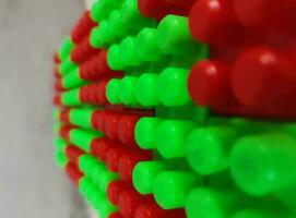 Abstract background pattern of colored building blocks. Pattern of plastic part of constructor block puzzle. photo