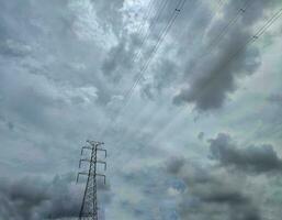 Electrical tower or transmission tower with cloudy photo