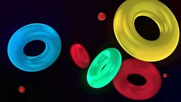 Abstract 3D background with colorful illuminated rings floating slowly. The rings float and collide smoothly. Floating Torus Loop Animation. Captivating Visuals in 4K. video