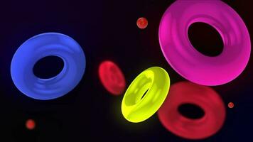 Abstract 3D background with colorful illuminated rings floating slowly. The rings float and collide smoothly. Floating Torus Loop Animation. Captivating Visuals in 4K. video