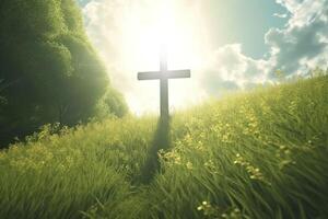 The cross of God with green Leaf, in the rays of the sun and blue sky. Cross on the hill with green trees and graeen natural view. Religious concept, photo