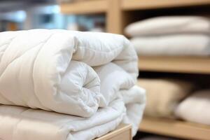 Beautiful luxury comfortable white pillow and blanket on bed decoration. Luxury white down comforter concept by photo