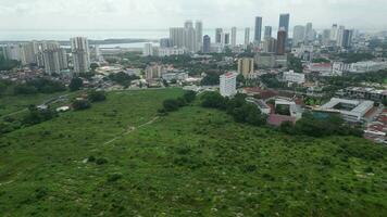 An aerial view of a city with tall buildings view from Chinese graveyard video