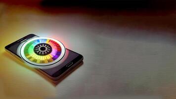 Colorful Glowing Roulette Wheel on Smartphone Screen and Copy Space for Online Casino Game Concept. Technology. photo