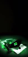 Glowing Playing Cards and Copy Space on Green Background for Gambling Concept. Technology. photo