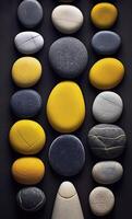 Some colorful stones are displayed, dark navy and yellow, photo