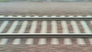 speeding by mesmerizing rail tracks, single line and crossing video