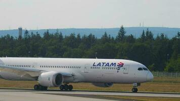 FRANKFURT AM MAIN, GERMANY JULY 18, 2017 - LATAM Airlines Boeing 787 CC BGE taxiing after landing on runway 25R. Fraport, Frankfurt, Germany video