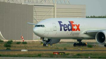 FRANKFURT AM MAIN, GERMANY JULY 18, 2017 - Boeing 777 FedEx Cargo N883FD flight FX3 from Munich MUC, taxiing after landing. Fraport, Frankfurt, Germany video