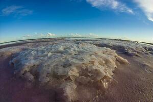 a view of the sky and water from a fish eye lens photo