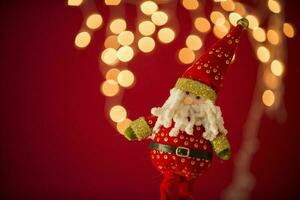 a santa claus doll with a beard and hat photo