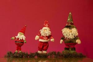 a santa claus doll with a beard and hat photo