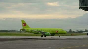 NOVOSIBIRSK, RUSSIAN FEDERATION JUNE 14, 2019 - Airbus 319 S7 Airlines VP BHG taxiing on the apron after landing, early morning. video