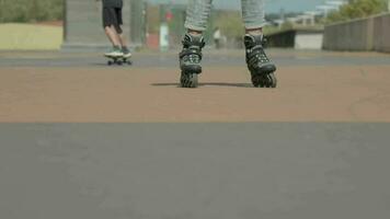 People skateboarding down a street video