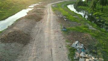 An aerial view of a dirt road near a river video